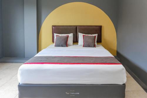 Imagen de la habitación del Hotel Capital O Bimo Slipi. Foto 20