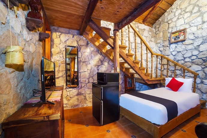 Imagen de la habitación del Hotel Capital O Caba&ntilde;as El Rinc&oacute;n. Foto 4