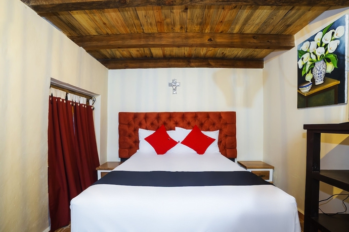 Imagen de la habitación del Hotel Capital O Caba&ntilde;as El Rinc&oacute;n. Foto 5