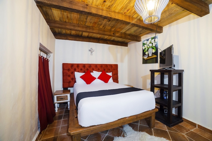 Imagen de la habitación del Hotel Capital O Caba&ntilde;as El Rinc&oacute;n. Foto 6