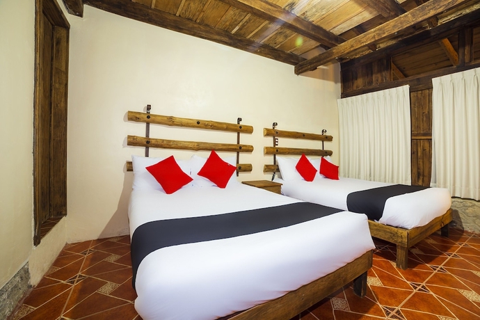 Imagen de la habitación del Hotel Capital O Caba&ntilde;as El Rinc&oacute;n. Foto 7