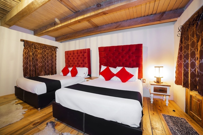 Imagen de la habitación del Hotel Capital O Caba&ntilde;as El Rinc&oacute;n. Foto 9