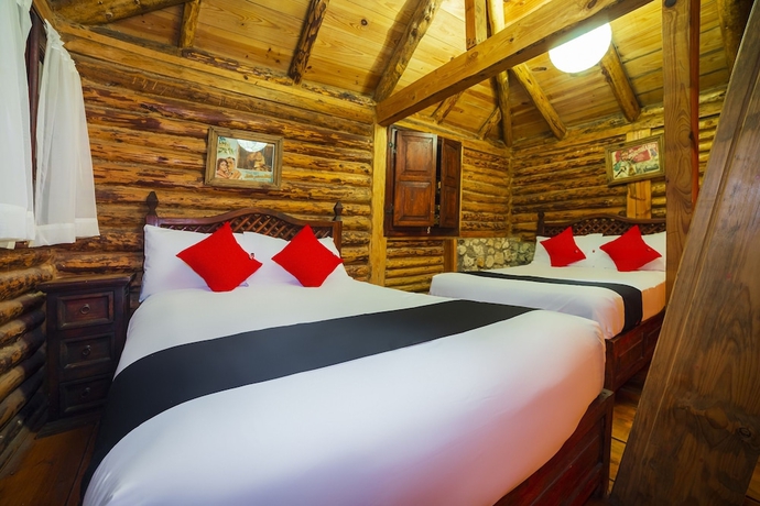 Imagen de la habitación del Hotel Capital O Caba&ntilde;as El Rinc&oacute;n. Foto 15