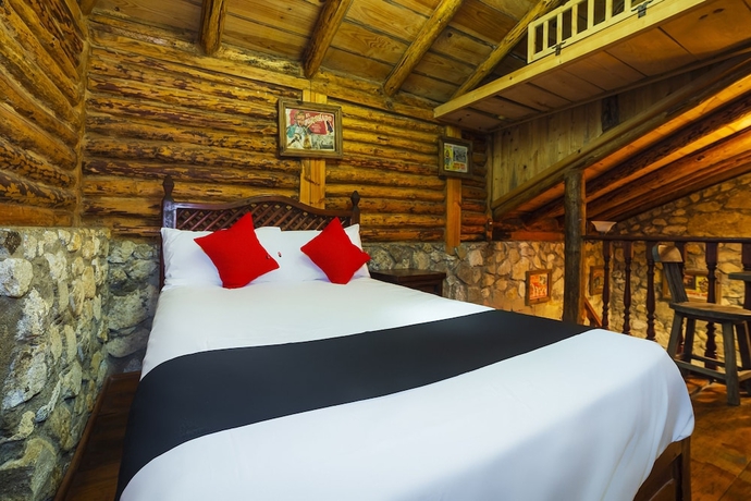 Imagen de la habitación del Hotel Capital O Caba&ntilde;as El Rinc&oacute;n. Foto 16