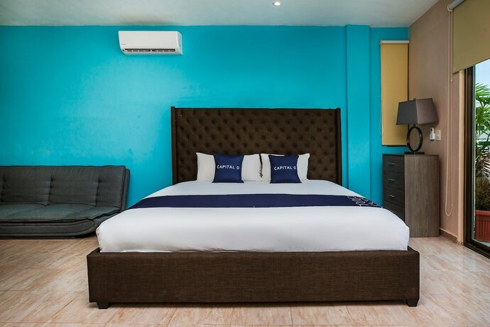 Imagen de la habitación del Hotel Capital O Cancun International Airport 24/7,. Foto 14