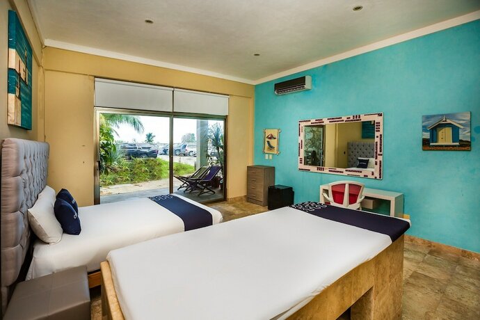 Imagen de la habitación del Hotel Capital O Cancun International Airport 24/7,. Foto 18