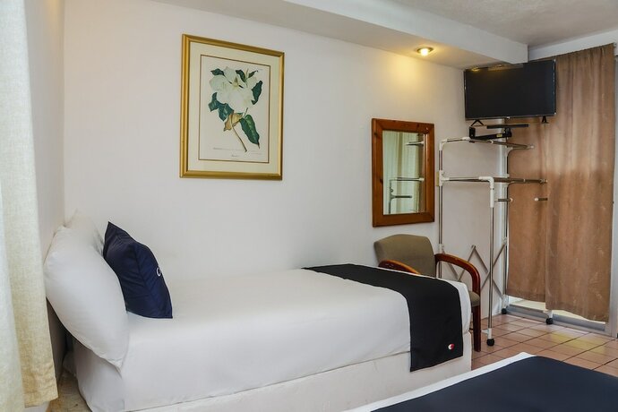 Imagen de la habitación del Hotel Capital O Dos Mares, Cabo San Lucas. Foto 16