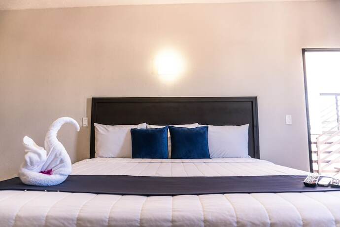 Imagen de la habitación del Hotel Capital O Hotel Jazuli. Foto 8