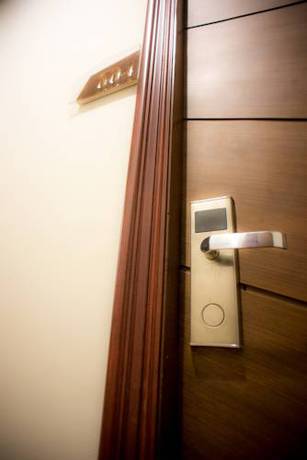 Imagen de la habitación del Hotel Capital O Ja Siam City. Foto 6