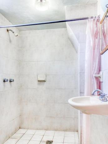 Imagen de la habitación del Hotel Capital O La Siesta. Foto 8