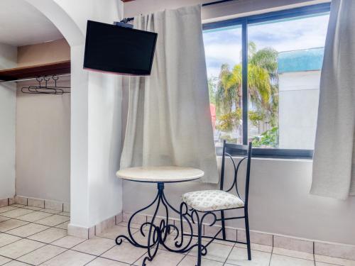 Imagen de la habitación del Hotel Capital O La Siesta. Foto 10