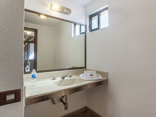 Imagen de la habitación del Hotel Capital O Mansión Los Arcos, Aguilares. Foto 11