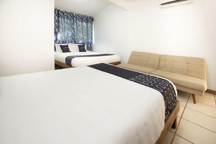Imagen de la habitación del Hotel Capital O Oxtankah,chetumal bay. Foto 3