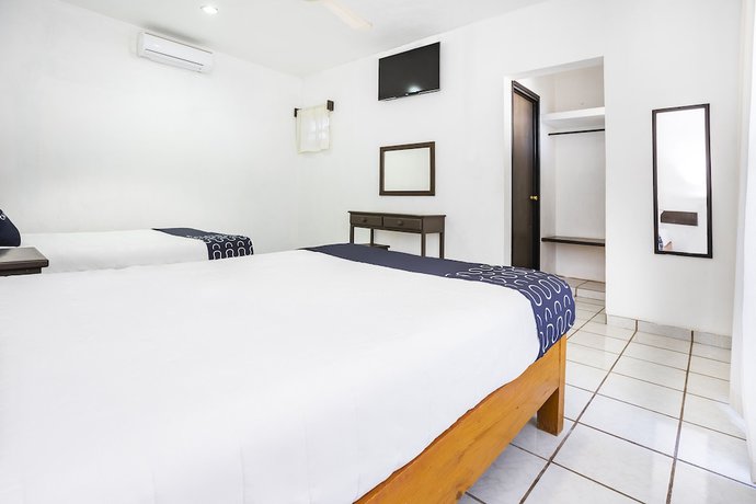 Imagen de la habitación del Hotel Capital O Oxtankah,chetumal bay. Foto 5