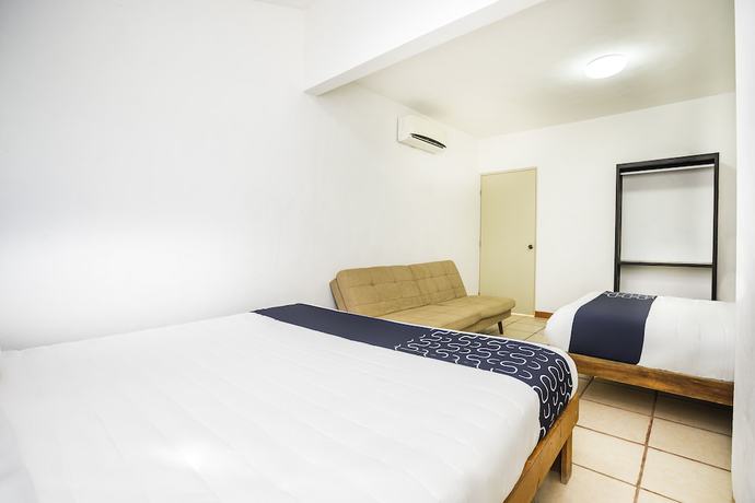 Imagen de la habitación del Hotel Capital O Oxtankah,chetumal bay. Foto 7