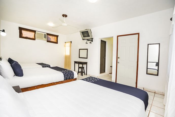Imagen de la habitación del Hotel Capital O Oxtankah,chetumal bay. Foto 8