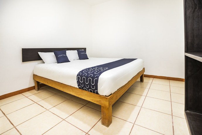 Imagen de la habitación del Hotel Capital O Oxtankah,chetumal bay. Foto 11