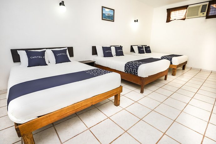 Imagen de la habitación del Hotel Capital O Oxtankah,chetumal bay. Foto 12