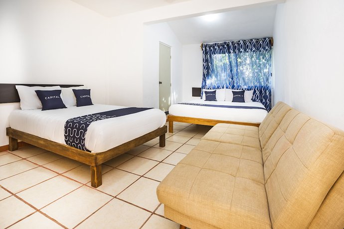 Imagen de la habitación del Hotel Capital O Oxtankah,chetumal bay. Foto 13