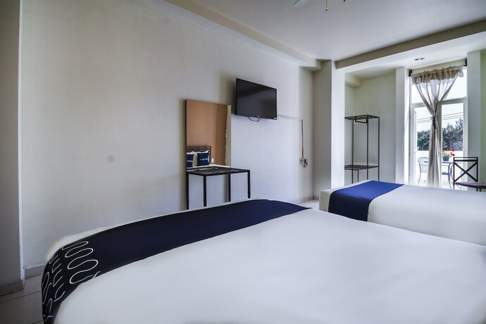 Imagen de la habitación del Hotel Capital O Plaza Galindo. Foto 18