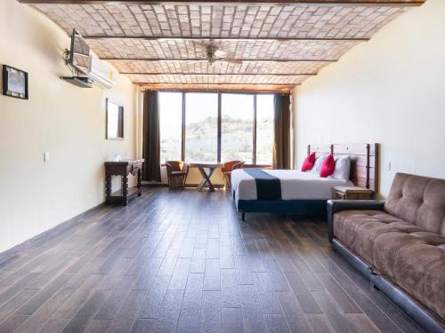 Imagen de la habitación del Hotel Capital O Posada Terraza. Foto 4