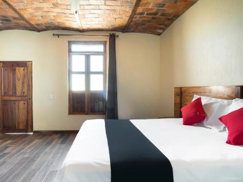 Imagen de la habitación del Hotel Capital O Posada Terraza. Foto 5