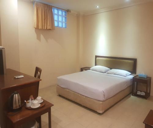 Imagen de la habitación del Hotel Capital O Siwah. Foto 18