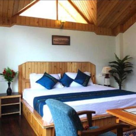 Imagen de la habitación del Hotel Capital O Stay Bless. Foto 18