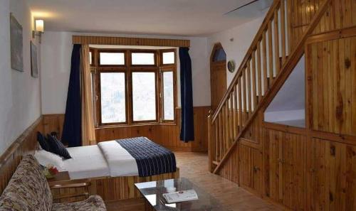 Imagen de la habitación del Hotel Capital O Stay Bless. Foto 19