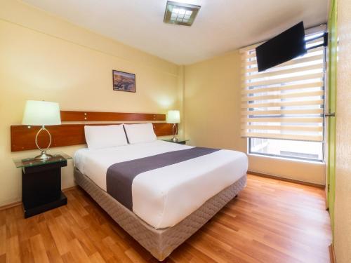 Imagen de la habitación del Hotel Capital O Suites Marne Cdmx. Foto 13