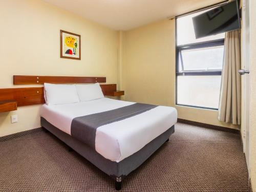 Imagen de la habitación del Hotel Capital O Suites Marne Cdmx. Foto 14