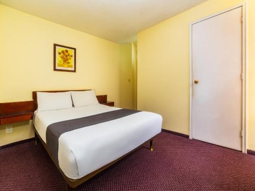 Imagen de la habitación del Hotel Capital O Suites Marne Cdmx. Foto 15