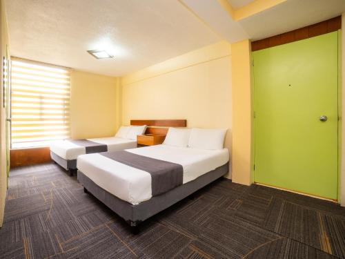 Imagen de la habitación del Hotel Capital O Suites Marne Cdmx. Foto 16