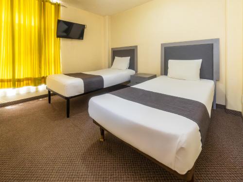 Imagen de la habitación del Hotel Capital O Suites Marne Cdmx. Foto 17