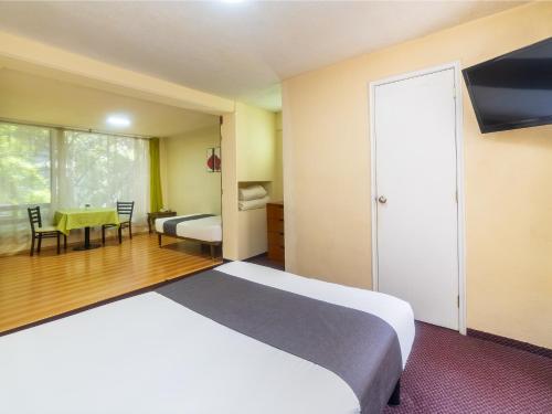 Imagen de la habitación del Hotel Capital O Suites Marne Cdmx. Foto 18