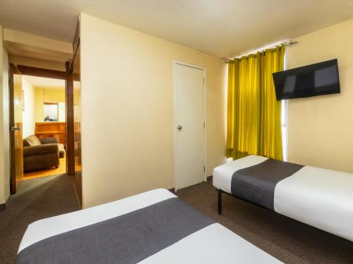 Imagen de la habitación del Hotel Capital O Suites Marne Cdmx. Foto 20