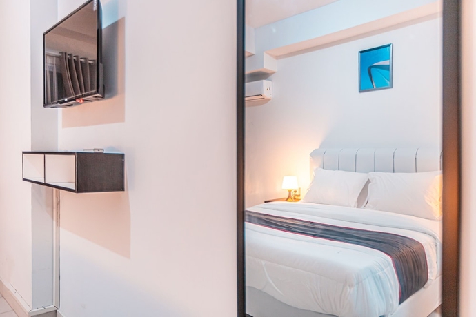 Imagen de la habitación del Hotel Capital O Urbano. Foto 10