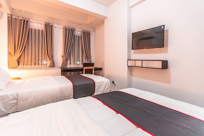 Imagen de la habitación del Hotel Capital O Urbano. Foto 12