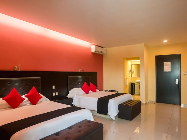 Imagen de la habitación del Hotel Capital O Veracruz Suites. Foto 3