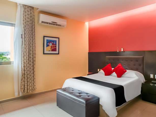 Imagen de la habitación del Hotel Capital O Veracruz Suites. Foto 4