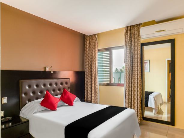 Imagen de la habitación del Hotel Capital O Veracruz Suites. Foto 5