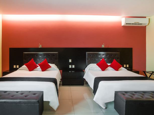 Imagen de la habitación del Hotel Capital O Veracruz Suites. Foto 8