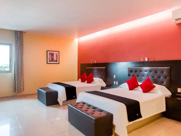 Imagen de la habitación del Hotel Capital O Veracruz Suites. Foto 9