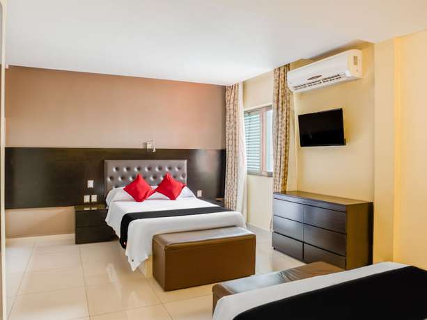 Imagen de la habitación del Hotel Capital O Veracruz Suites. Foto 10