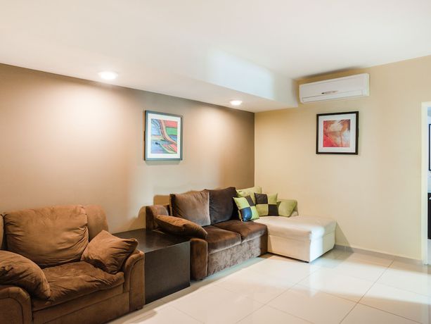 Imagen de la habitación del Hotel Capital O Veracruz Suites. Foto 11