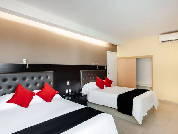 Imagen de la habitación del Hotel Capital O Veracruz Suites. Foto 12