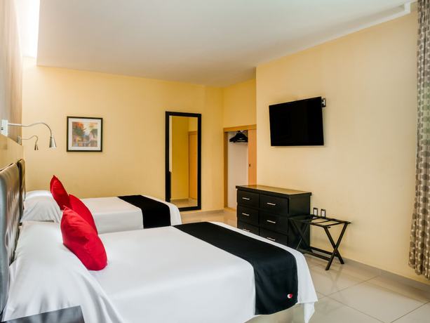 Imagen de la habitación del Hotel Capital O Veracruz Suites. Foto 13
