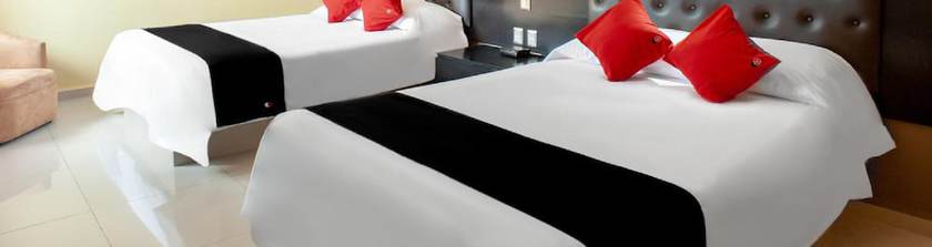 Imagen de la habitación del Hotel Capital O Veracruz Suites. Foto 15