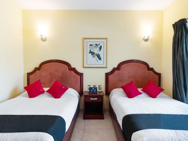Imagen de la habitación del Hotel Capital O Vital&eacute;. Foto 6