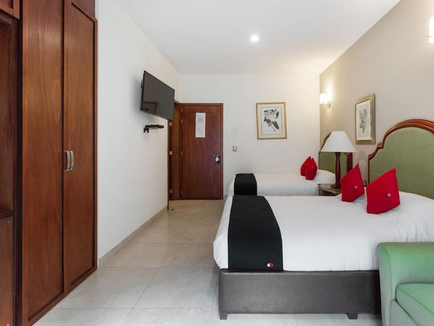 Imagen de la habitación del Hotel Capital O Vital&eacute;. Foto 13